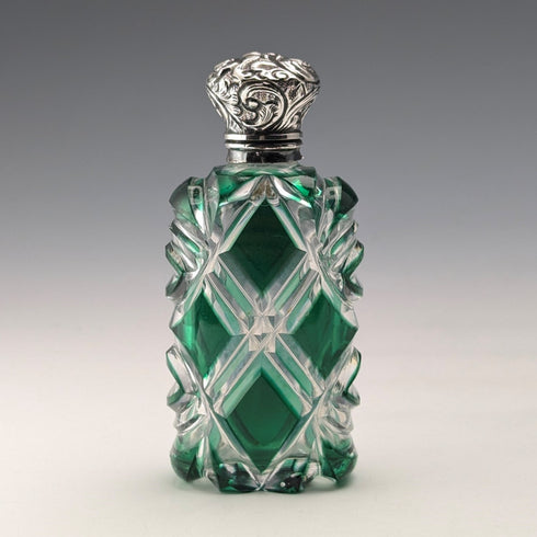 Antique British silver-lidded green cut glass portable perfume bottle